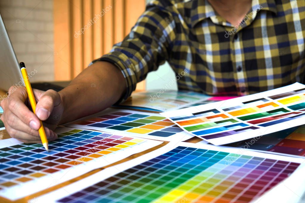 Graphic designers choose colors from the color bands samples for design .Designer graphic creativity work concept . 