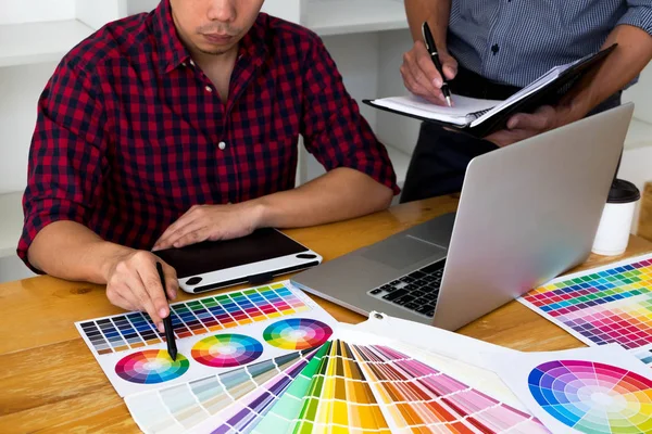 Graphic designers choose colors from the color bands samples for