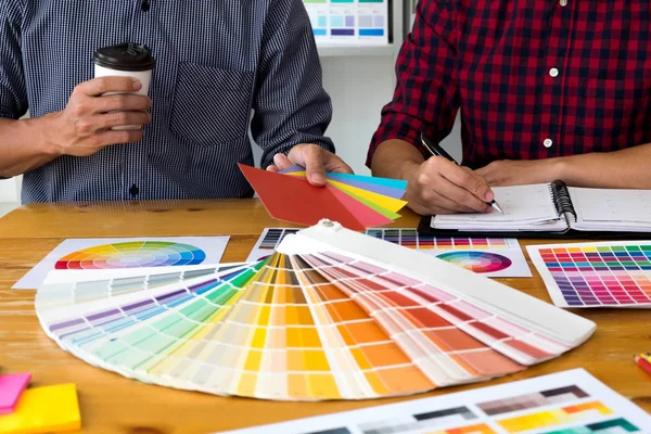 Graphic designers choose colors from the color bands samples for — Stock Photo, Image