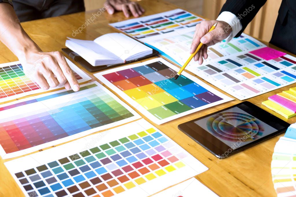 Graphic designers choose colors from the color bands samples for