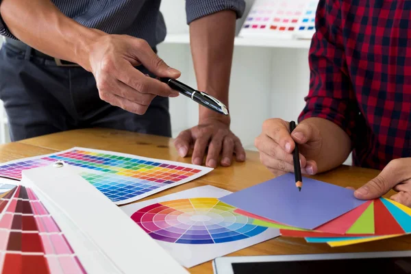 Graphic designers choose colors from the color bands samples for — Stock Photo, Image