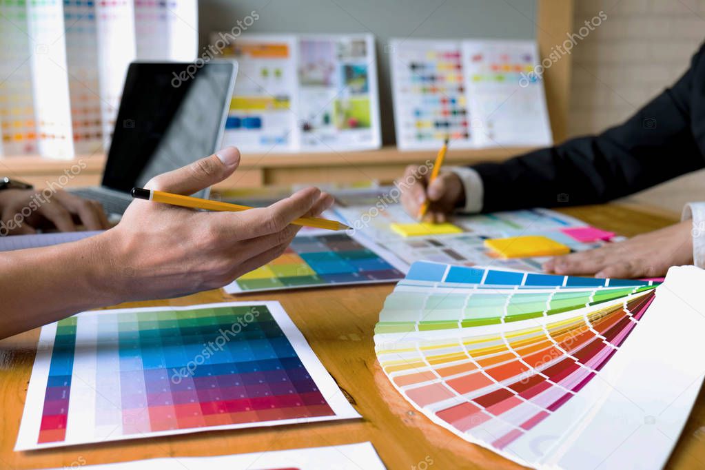 Graphic designers choose colors from the color bands samples for