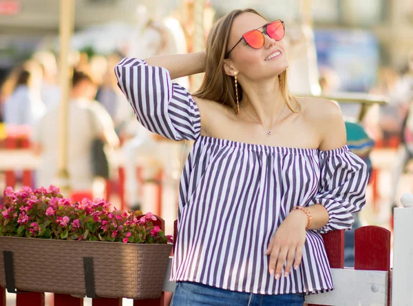 Girl Bright Red Glasses Stroking Her Hair Backdrop Carousel Summer Stock Picture