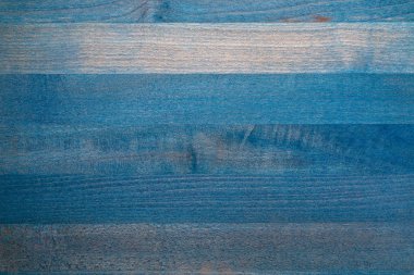 Ahşap masa mavi renkli güzel dokusuna. Lamas yatay olarak. Kendi metninizi eklemek için alan.