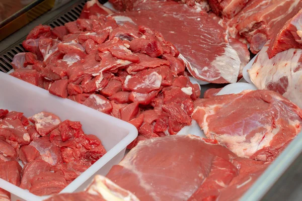 Pork cut into pieces and whole, raw pieces ready to cook