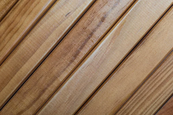 Texture of natural wood slats (varnished). Diagonal sense.