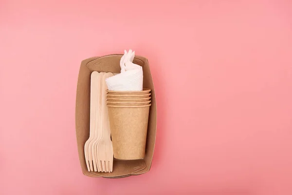 Eco-friendly disposable utensils made of bamboo wood and paper, isolated
