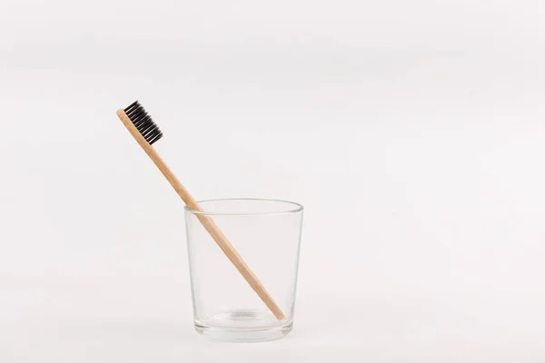 Bamboo toothbrush in glass on white background. Concept eco-friendly, no plastic, zero waste life — Stock Photo, Image