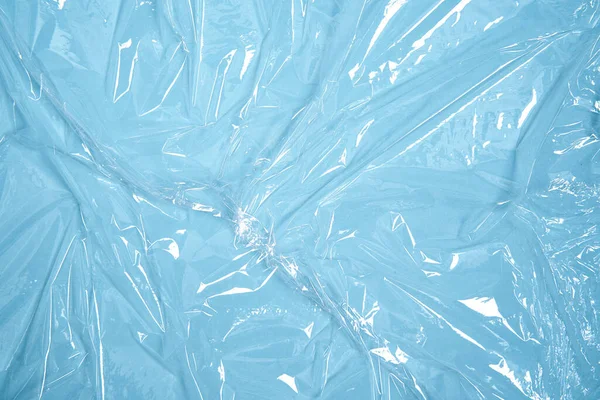 Clear plastic texture with blue color. Nylon polythene wrap. Plastic free lifestyle, ecology pollution