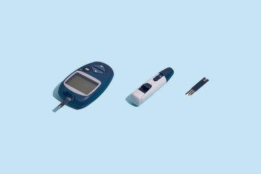 Glucose meter and pen on blue background with shadow, Metabolic syndrome concept clipart