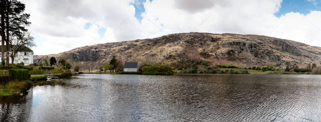 View of the Gouganebarra Lake and the river Lee outside of Saint Finbarr Oratory chapel in county Cork, Ireland.