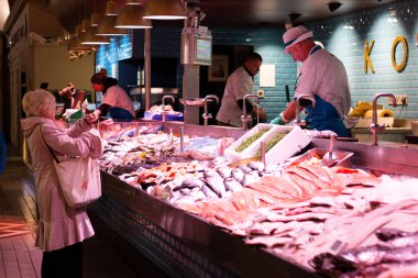 August 4th, 2017, Cork, Ireland - customers at the English Market, a municipal food market in the centre of Cork, a famous tourist attraction. clipart