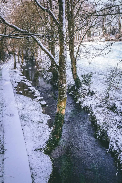 Irish village during Storm Emma, also known as the Beast from the East, which hit Ireland in the beginning of March: cars covered in snow and roads completely white.