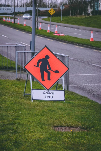 Close up of a road work warning road sign