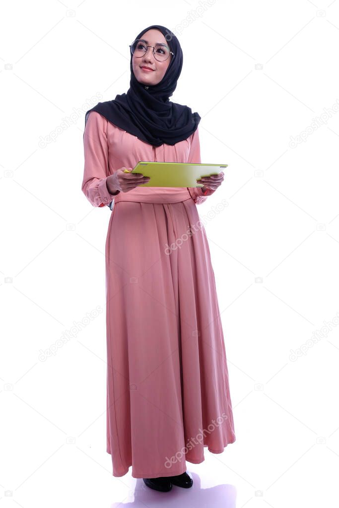 Confidence of interactive pretty muslim woman with tablet. Business or Finance interactive conceptual