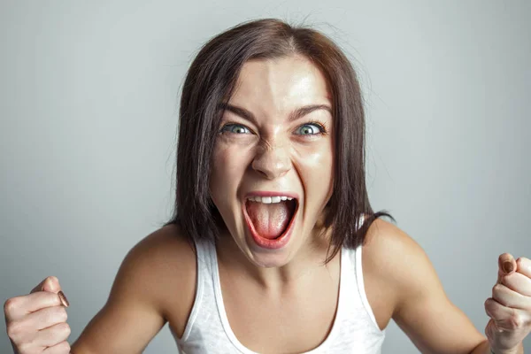 Woman screams in rage. Emotion concept