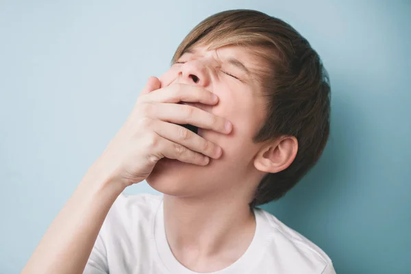 Boy Yawns His Eyes Closed Covering His Mouth His Palm — Stock Photo, Image
