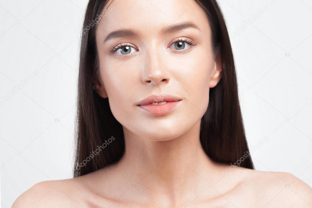 Young beautiful woman with clean perfect skin closeup. Beauty portrait