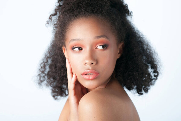 Young beautiful black girl with clean perfect skin close-up. Beauty portrait