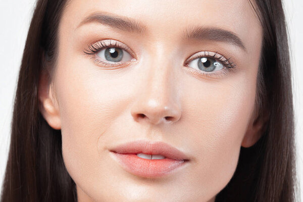 Portrait of young beautiful woman with clean perfect skin. Beauty and skin care concept