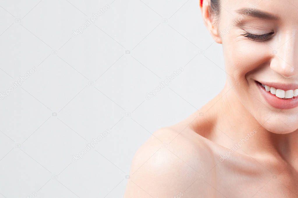 Portrait of young beautiful woman with clean perfect skin. Beauty and skin care concept