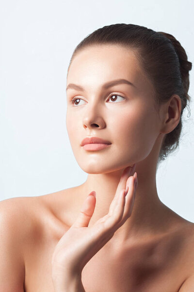 Young beautiful woman with clean perfect skin close-up