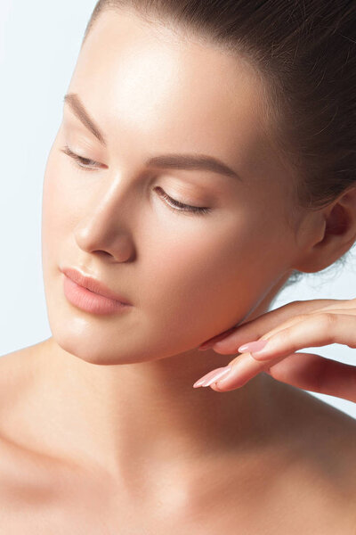 Young beautiful woman with clean perfect skin close-up