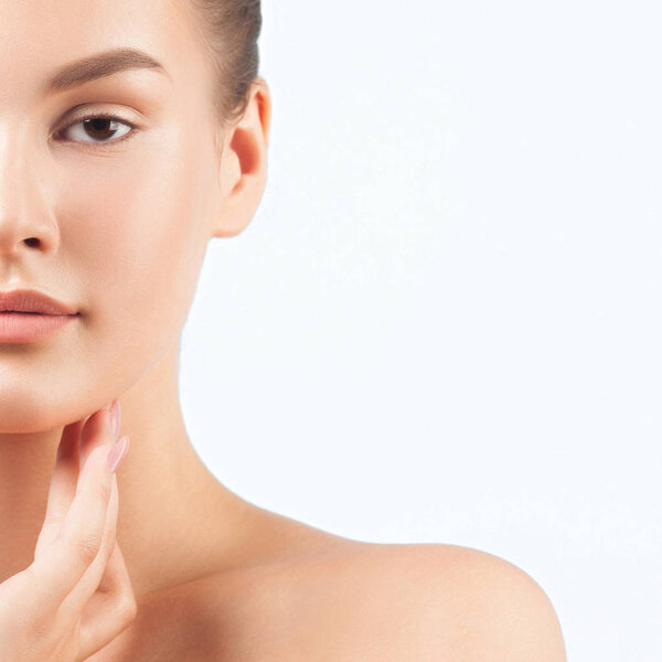 Young beautiful woman with clean perfect skin close-up