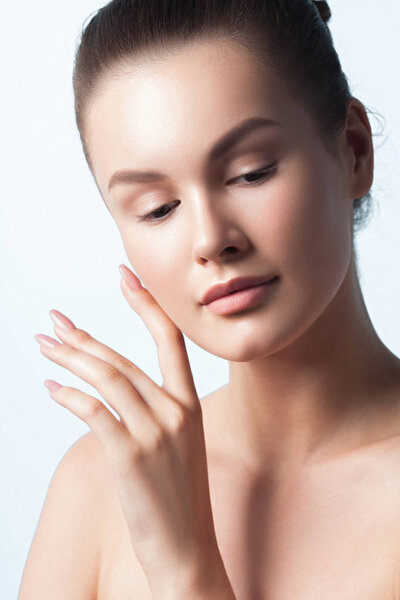 Young beautiful woman with clean perfect skin close-up