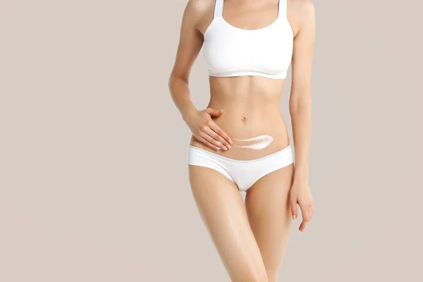 Slim Young Woman Underwear Apply Cream Belly Beige Background Skin — Stock Photo, Image