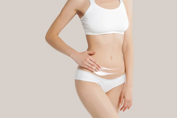 Slim Young Woman Underwear Apply Cream Belly Beige Background Skin — Stock Photo, Image