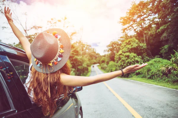 Asian women travel relax in the holiday. Traveling by car park. happily With nature, rural forest. drive a car, countryside, nature, outdoor, holiday, sport, relax, travel, summer.