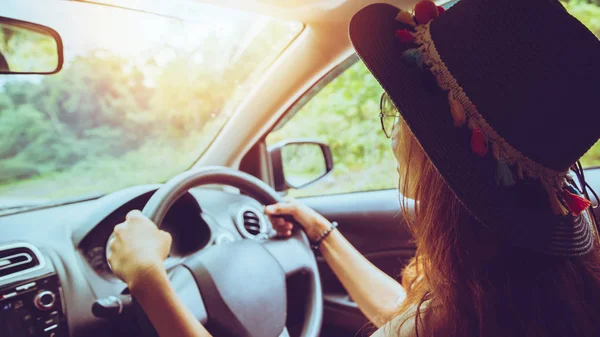 Asian women travel relax in the holiday. Traveling by car park. happily With nature, rural forest. drive a car, countryside, nature, outdoor, holiday, sport, relax, travel, summer.