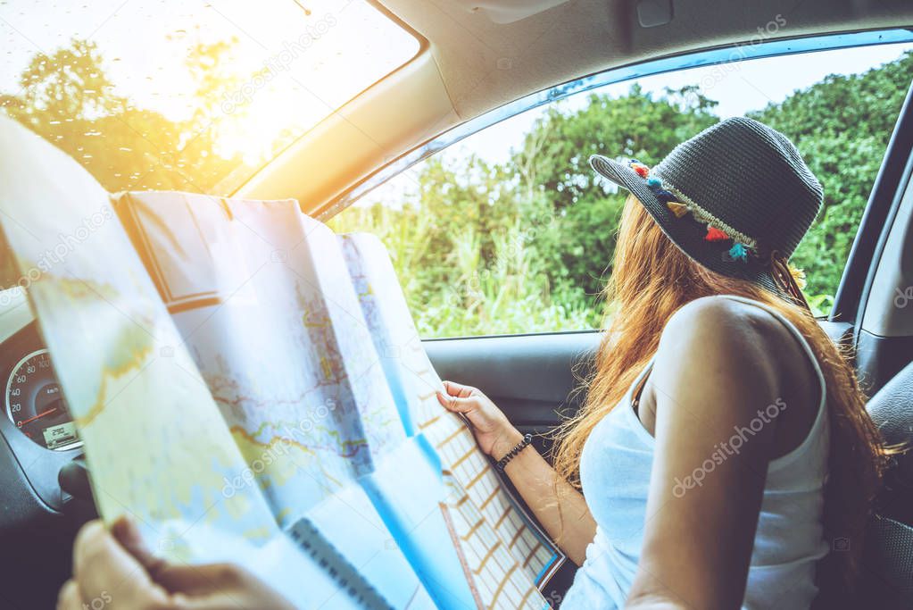 Asian women travel relax in the holiday. Traveling by car park. 