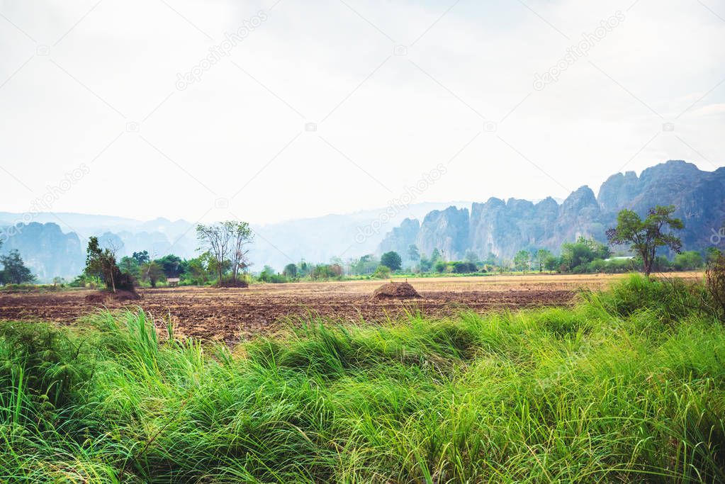 Rural landscape. Fields in season Natural rocky mountains