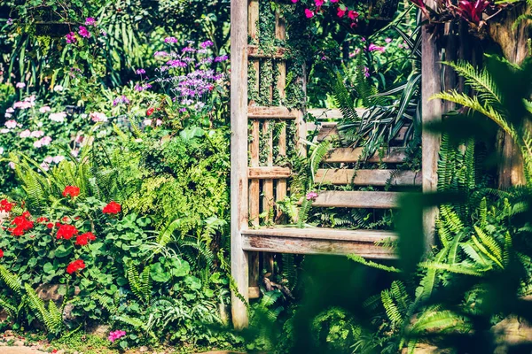 Bench in the flower garden. In the park