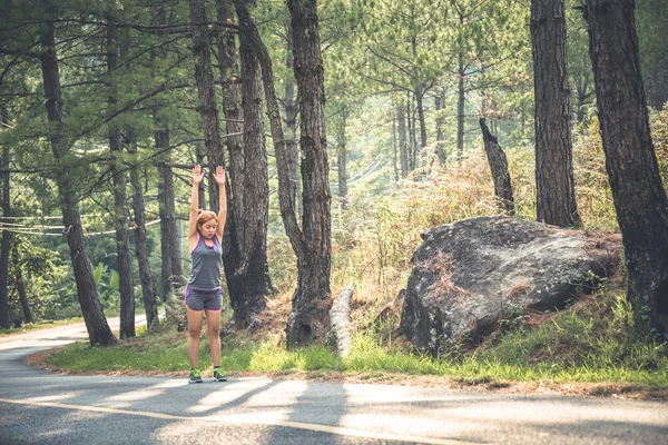 Women jogging On the nature trail in the park. Run, Jogging, summer, nature, outdoor, holiday, sport, exercise, relax, travel Thailand.