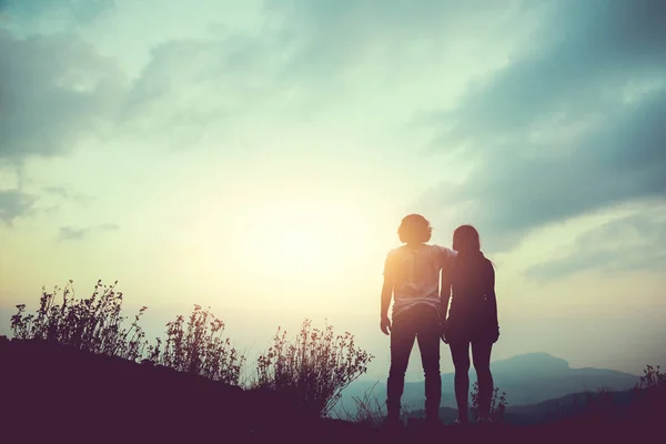 Natural background Couples lovers. The sun rises in the morning on the mountain. thailand doi inthanon, Couples who are standing watching the mountain view.