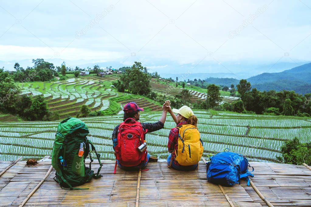 Lover woman and man Asian travel nature. Travel relax. Viewpoint Rice field of the field on the Moutain papongpieng in summer. Thailan