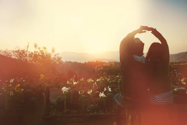 Natural background Couples lovers. The sun rises in the morning on the mountain.