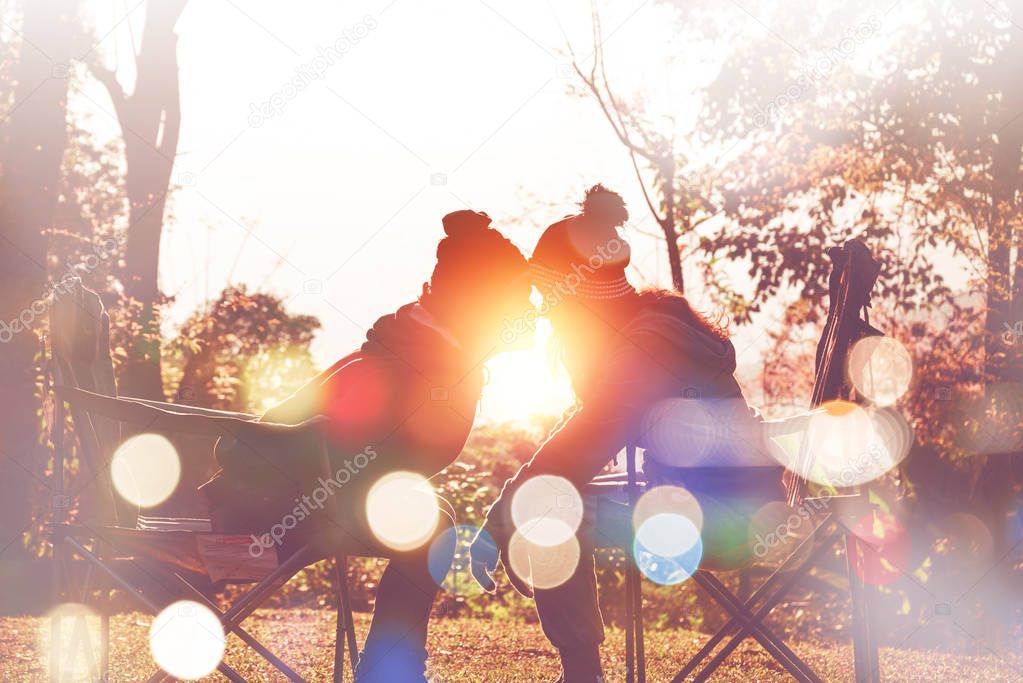 Tourists photograph the sunrise in the morning on the mountain. Couples Valentine's Day