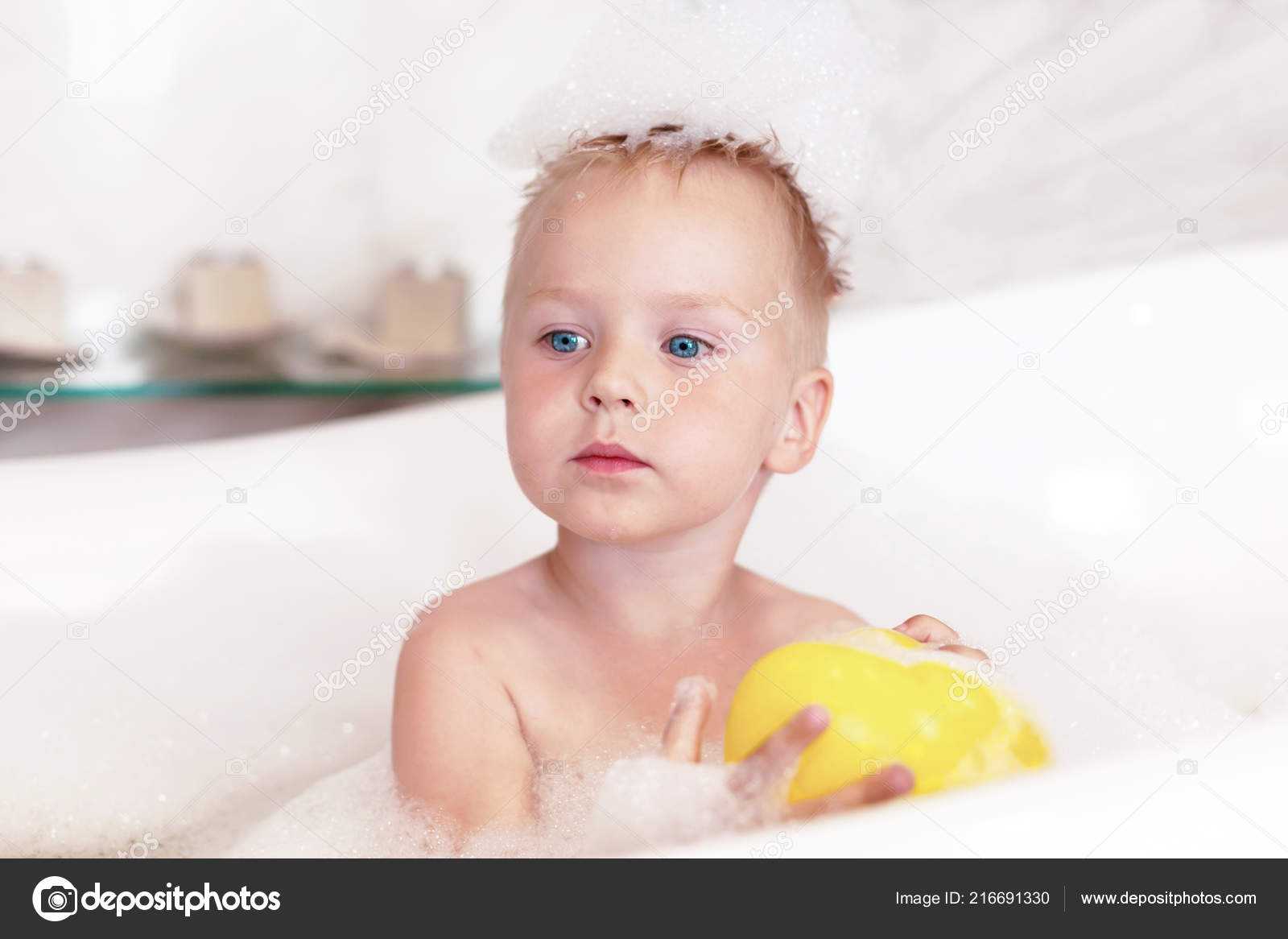 Cute Serious Caucasian Boy Blue Eyes Blonde Hair Sits Bathtube