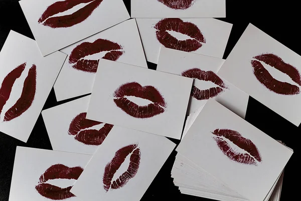 Lip prints over white visit cards