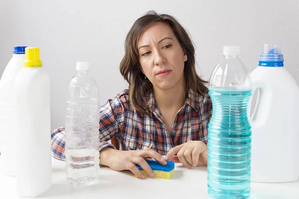 A woman wondering about cleaning and cleaning products