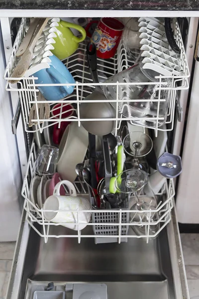 A slim line dishwasher with clean utensils