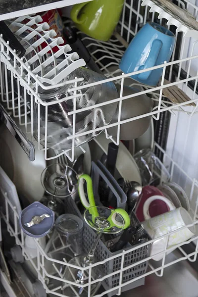 A slim line dishwasher with clean utensils