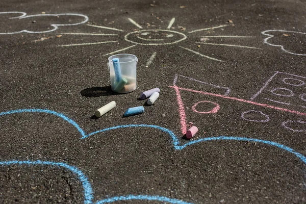 drawings on pavement. children\'s drawings with crayons on the pavement