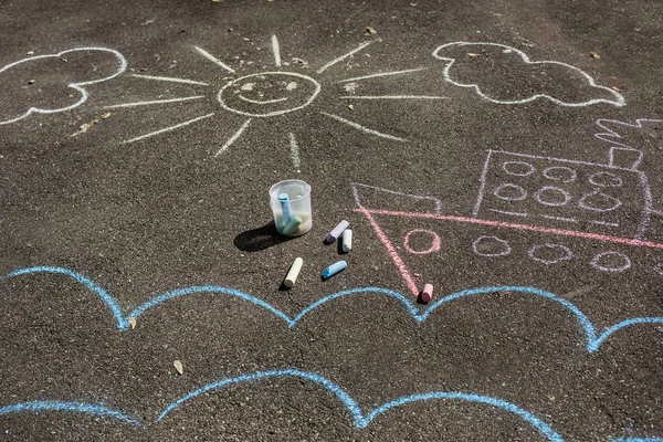 drawings on pavement. children\'s drawings with crayons on the pavement