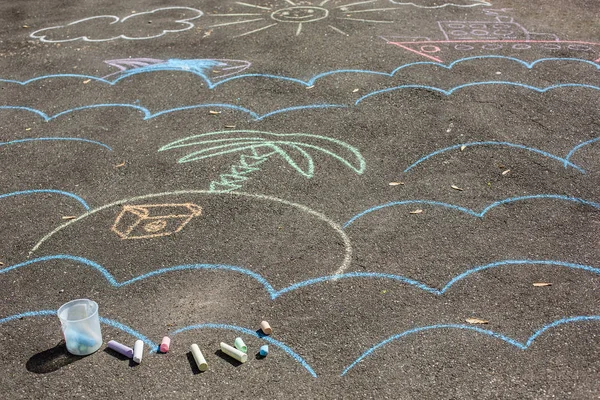 drawings on pavement. children\'s drawings with crayons on the pavement