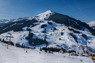 Beautiful view of the snowy mountains, winter sport. Panorama of the Austrian ski resort of Saalbach-Hinterglemm , Austria clipart